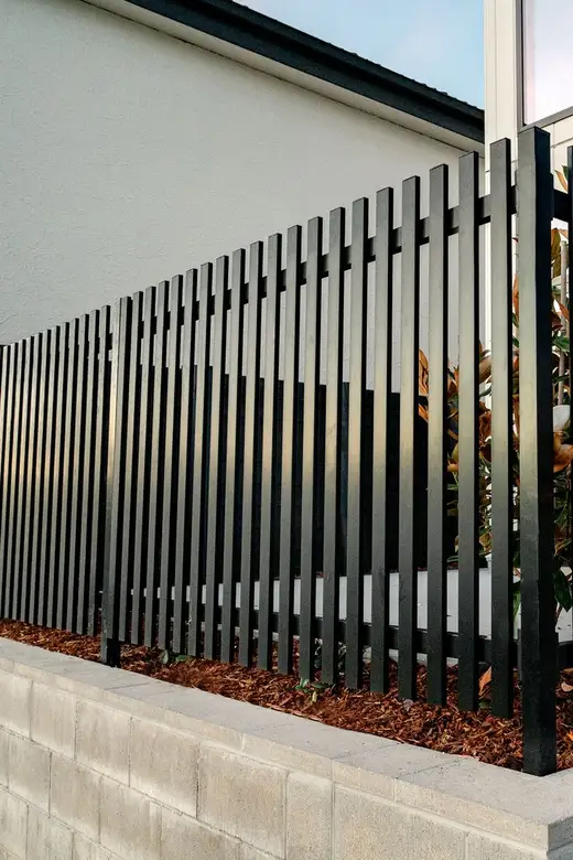 Slatted boundary fence
